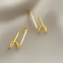 Radiant Crossing Gold Earrings